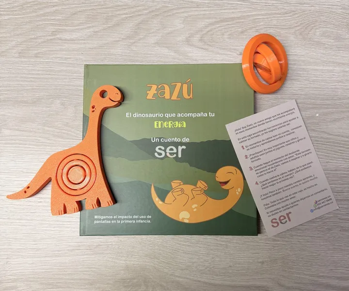 Kit Zazú: cuento, juguete naranja con tornado giratorio y guía de uso
